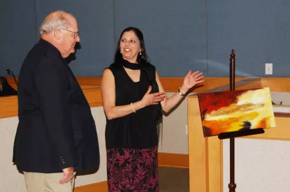 Artist with her painting and Mayor Heitzler