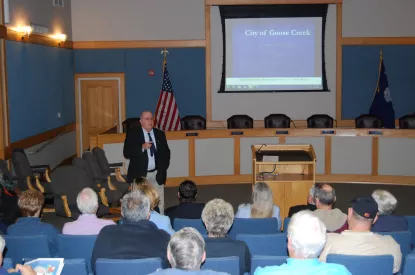 Mayor Heitzler speaking at town meeting