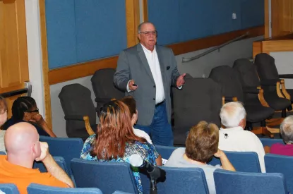 Mayor Heitzler speaking at town meeting