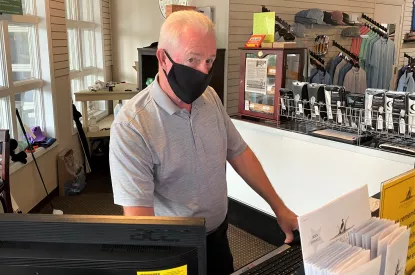 Rick Rose at front desk in Crowfield Golf Club