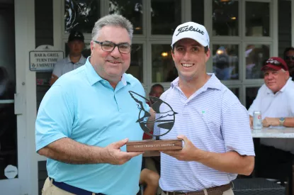 golf champion with trophy and Mayor Habib